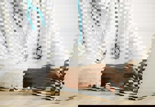 Doctor Using A Computer