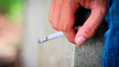 Someone Holding A Cigarette