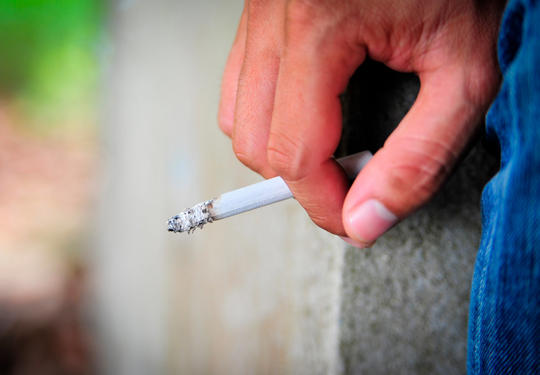 Someone Holding A Cigarette