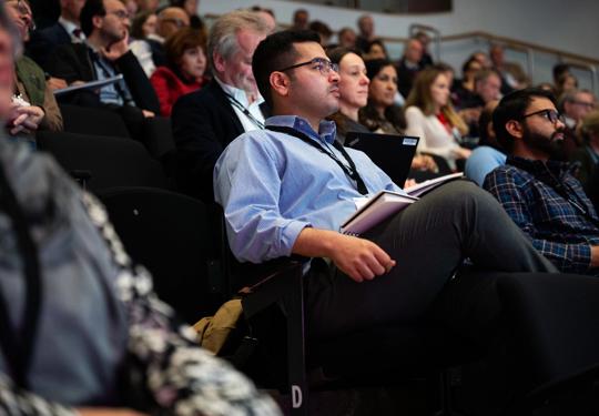 Attendees Watching Conference (3)