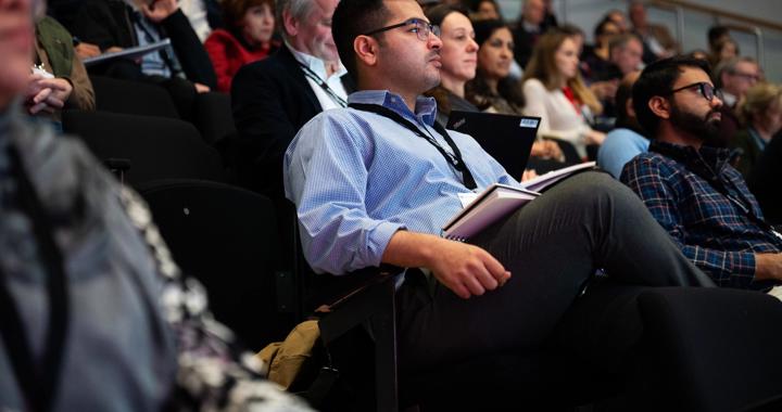 Attendees Watching Conference (3)