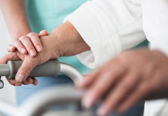 Elderly person with healthcare worker