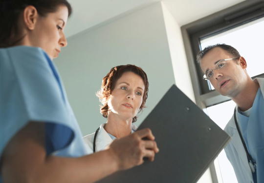 Doctors Looking At A File