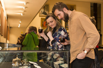 Visitors Looking Into A Display Case At The Rcp Museum (1)